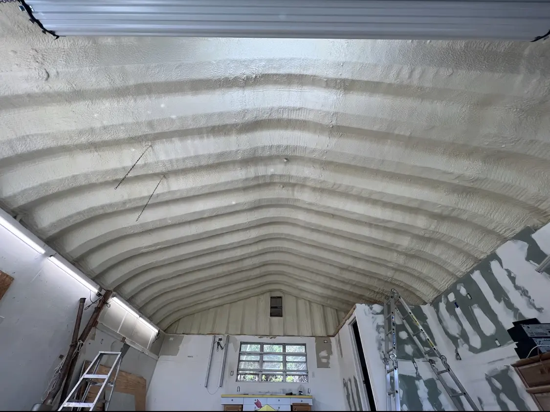 Spray polyurethane foam applied to the underside of a metal roof deck in Bellaire